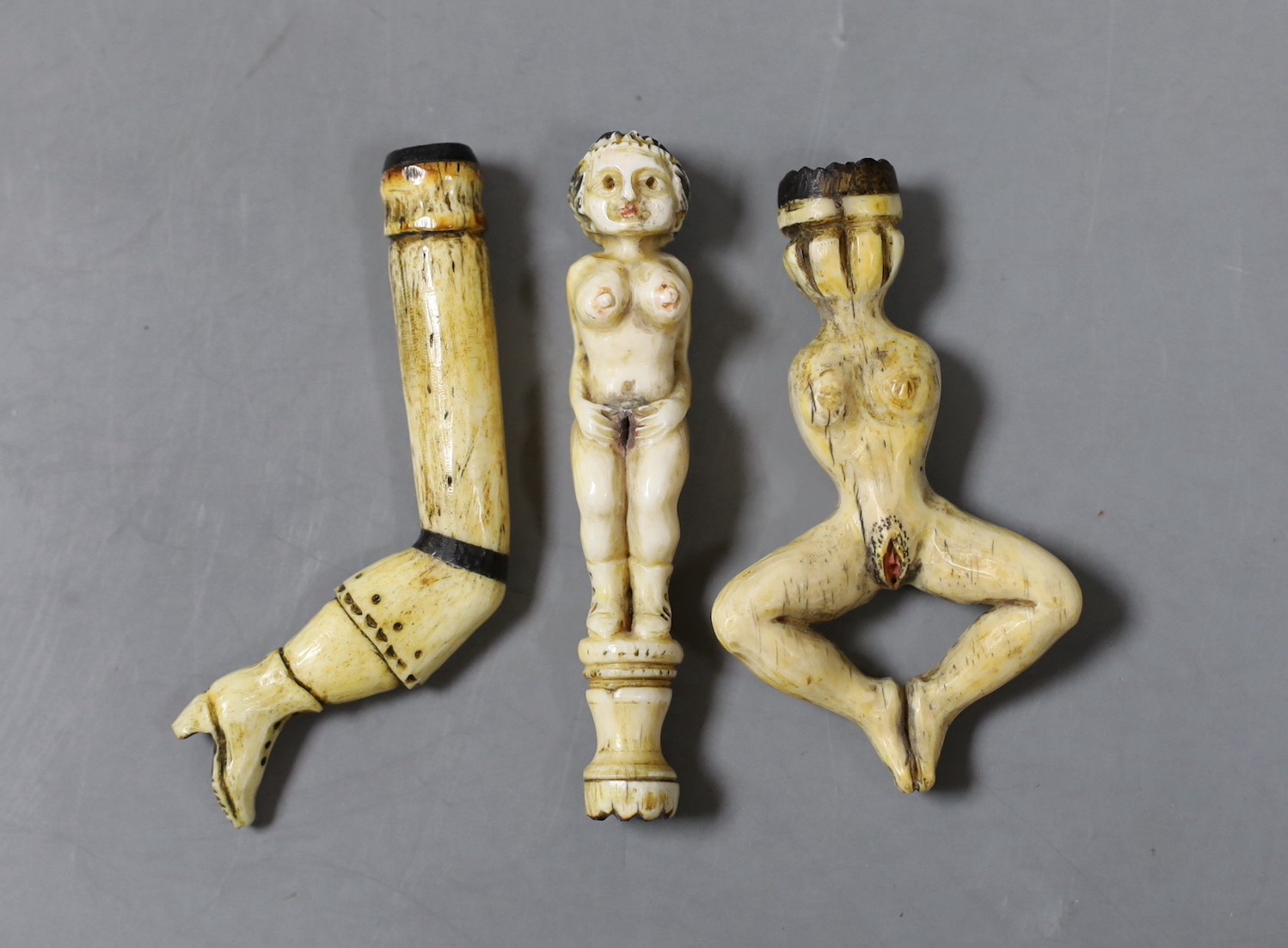 Three prisoner of war bone pipe tamper figures